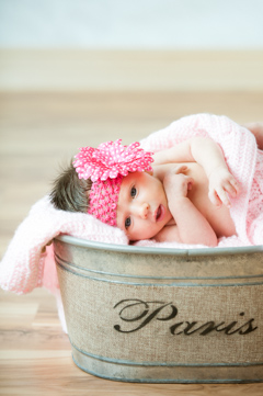 baby girl in pink in paris bucket in durango co studio