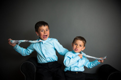 brothers in shirts and ties funny studio portrait