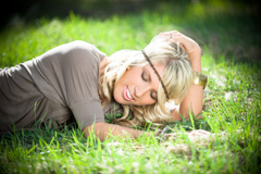 lying in spring grass senior model photo durango co