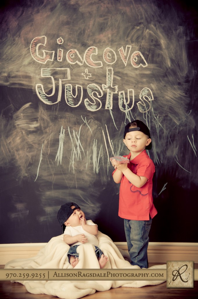 older brother baby sister chalkboard wall in studio pic durango co