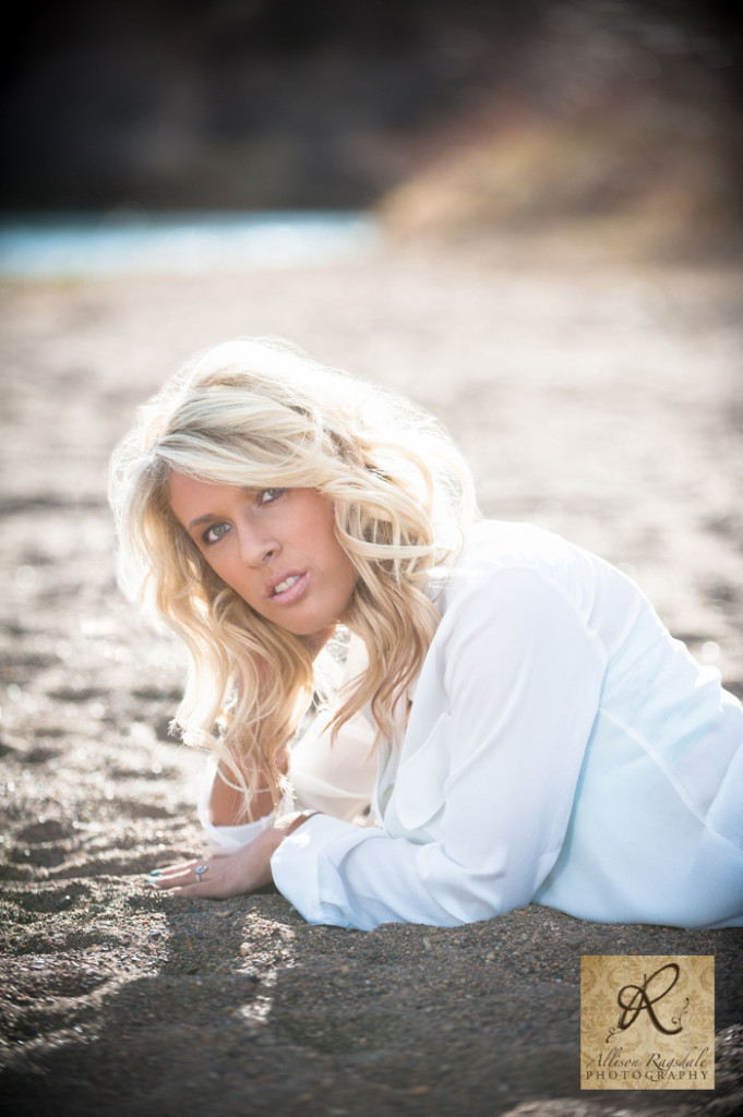 laying in the sand by the river durango co senior pic