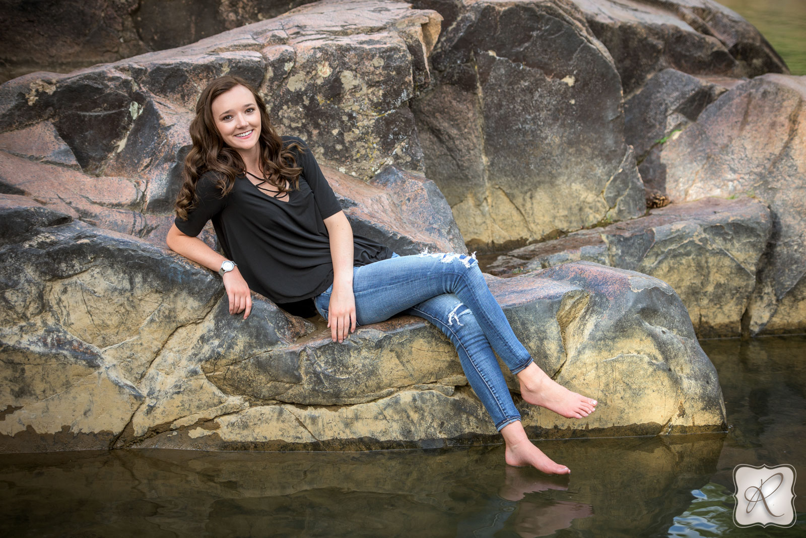 Senior pictures in Durango, Colorado, sitting on rocks
