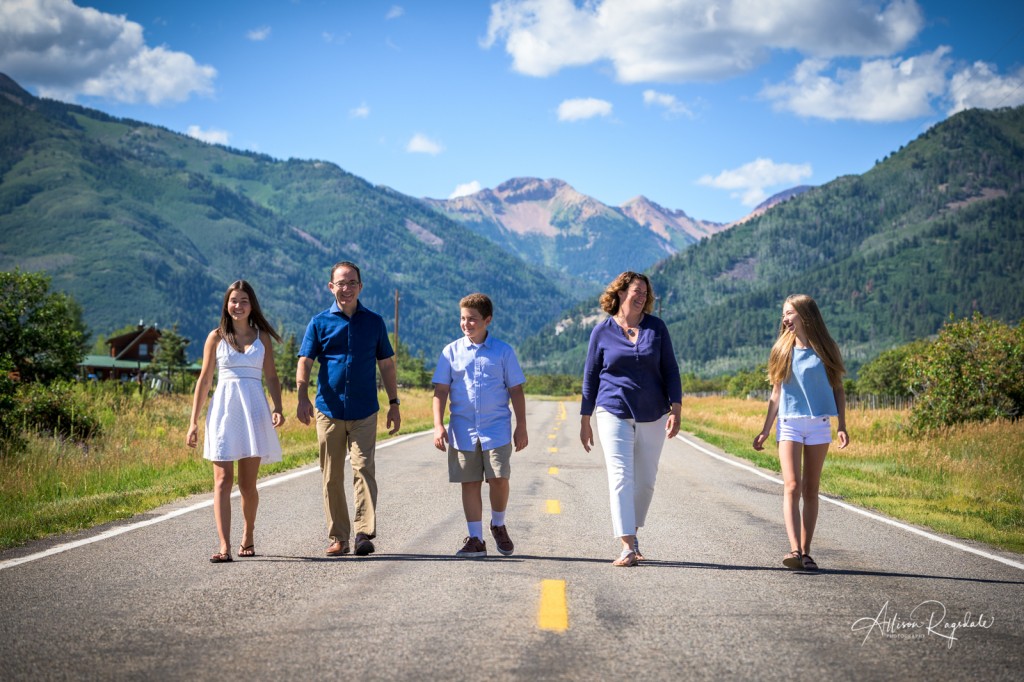 Family pictures in the mountains with road