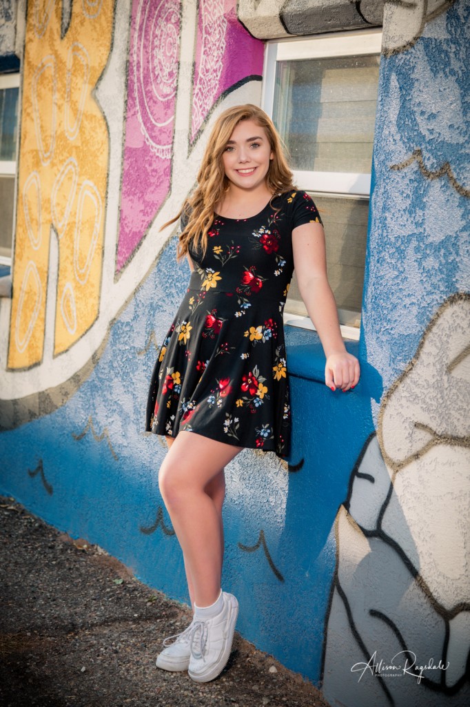 Cool senior pictures with mural