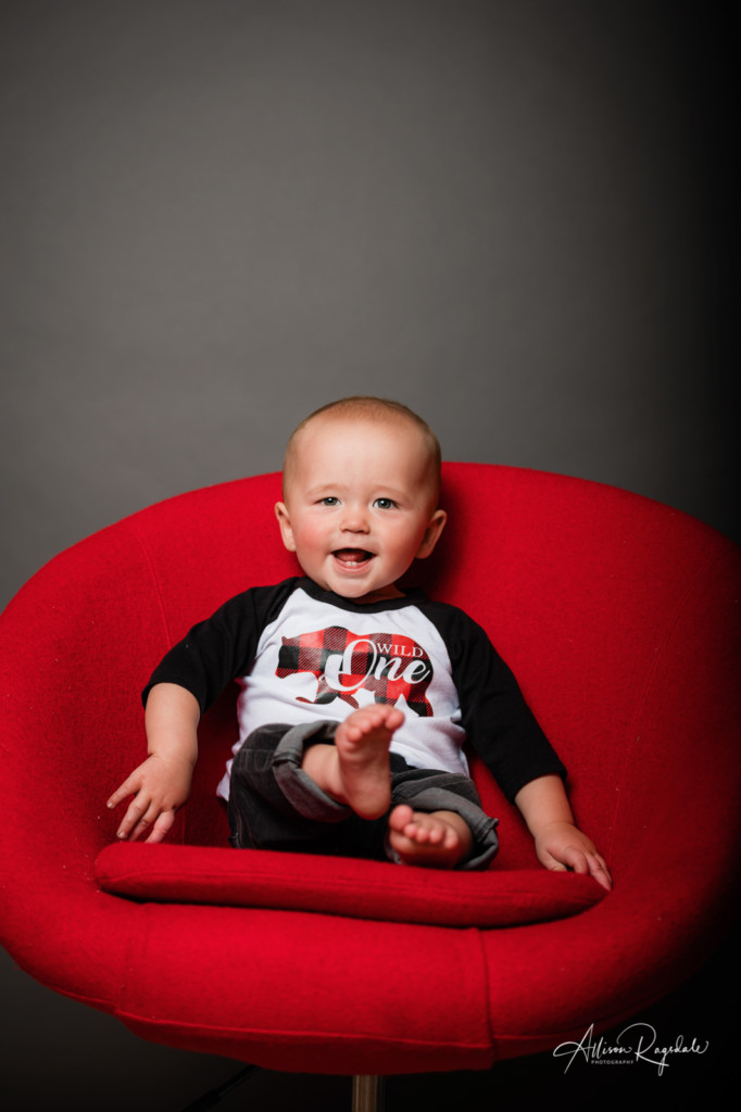 cute baby in red chair