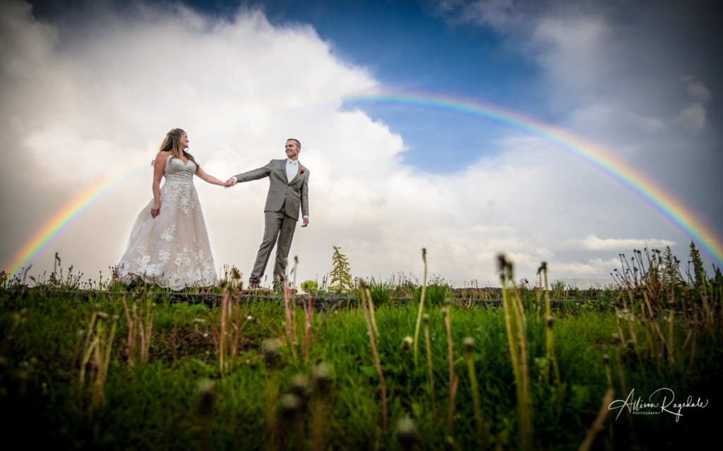 bride and groom portrait with full rainbow purgatory mountain wedding