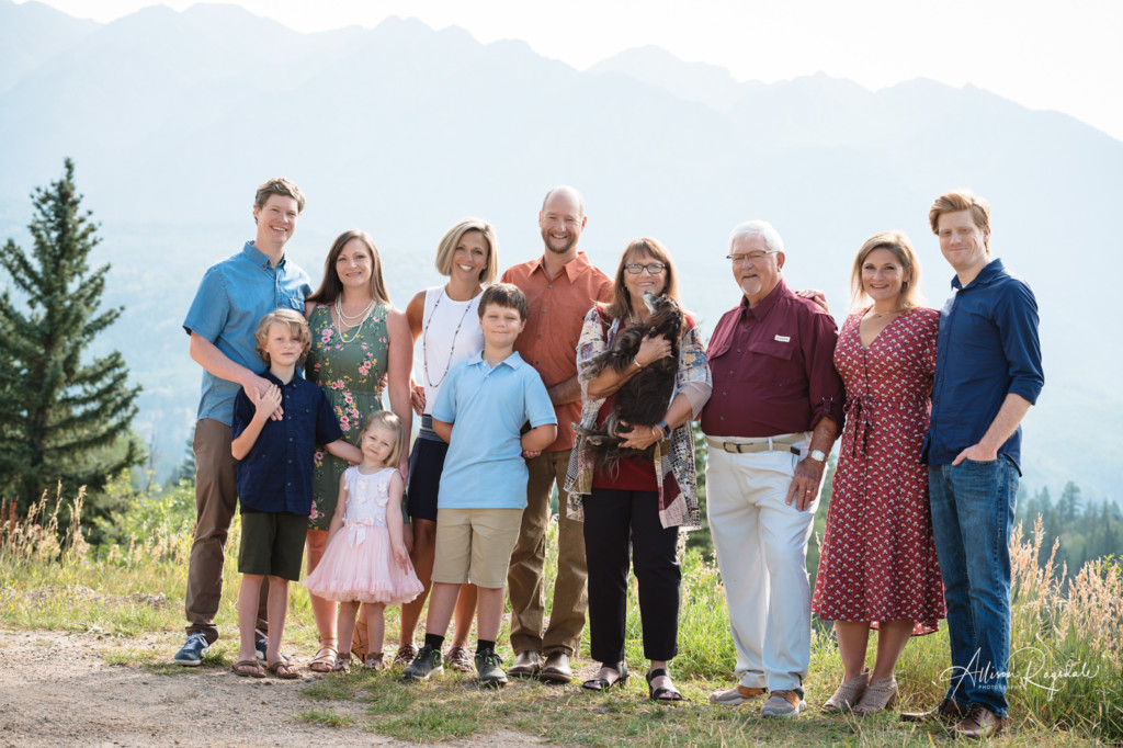 extended family portrait with dog and colorado mountain background