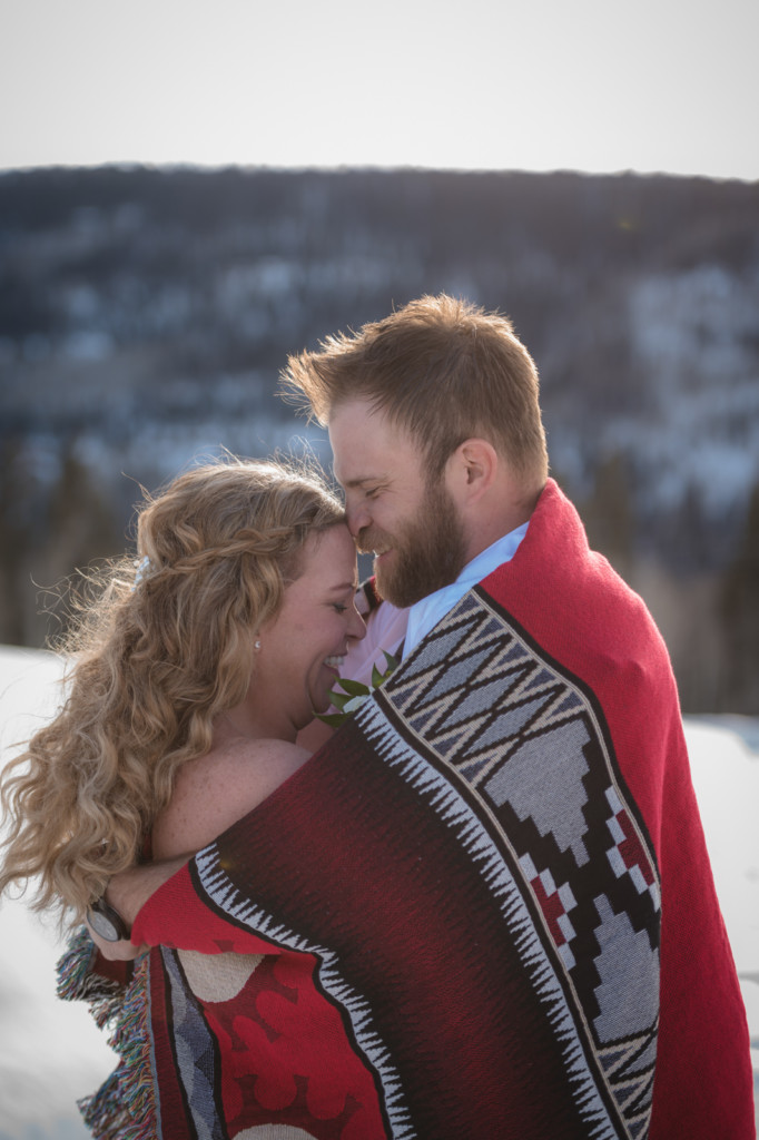 elopement couple wrapped in blanket portrait