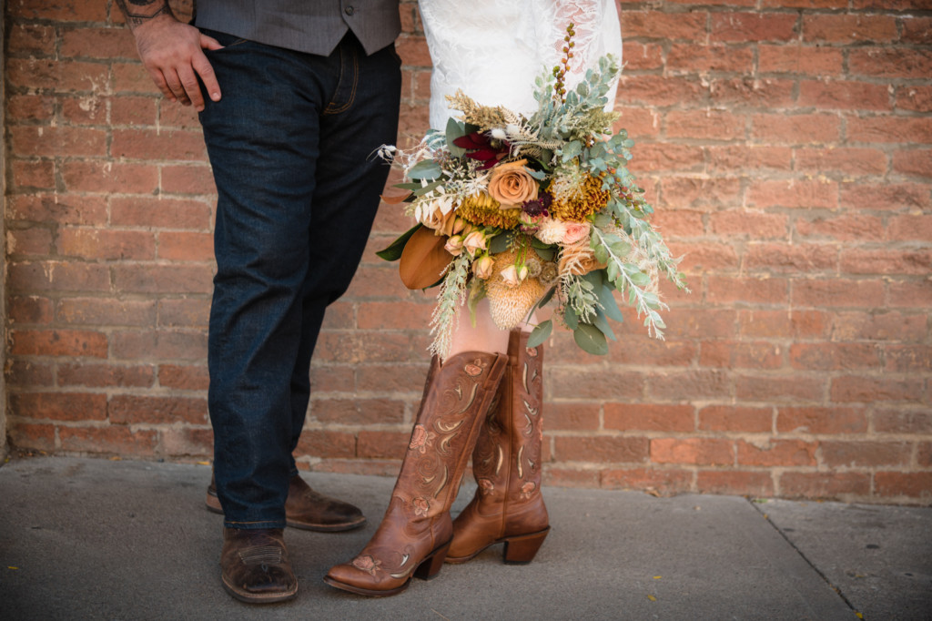 adela floral wedding bouquet with cowboy boots downtown durango photo