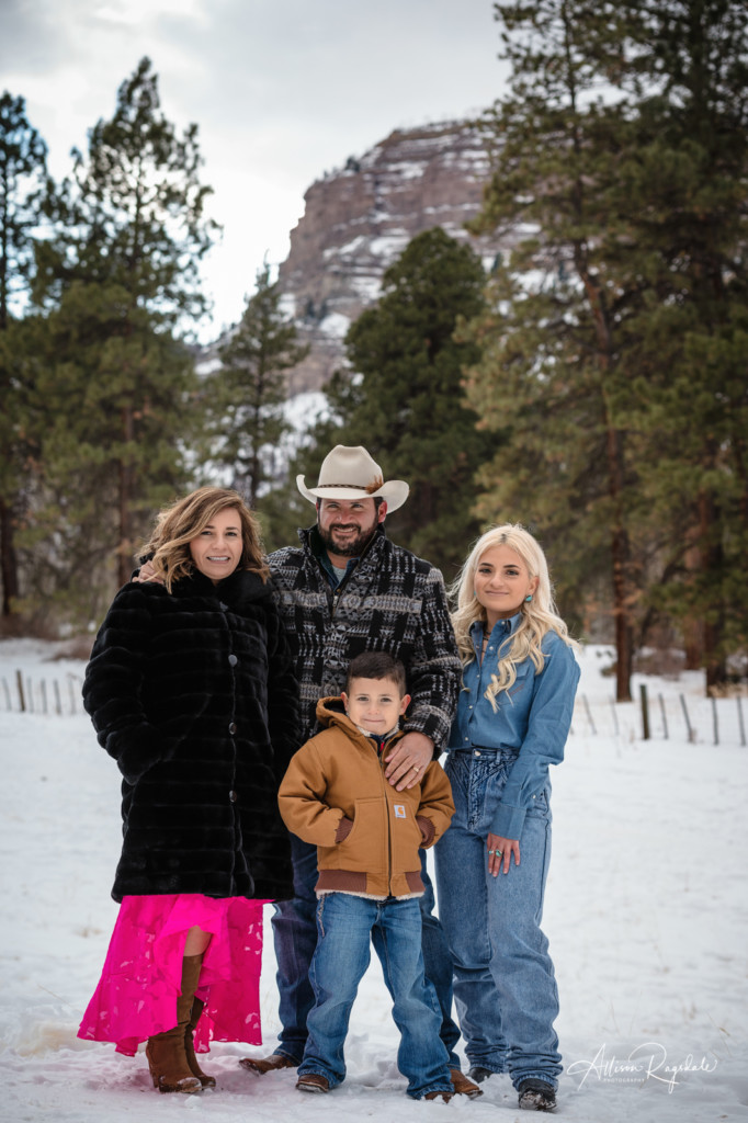 family photo with colorado cliffs in winter photoshoot