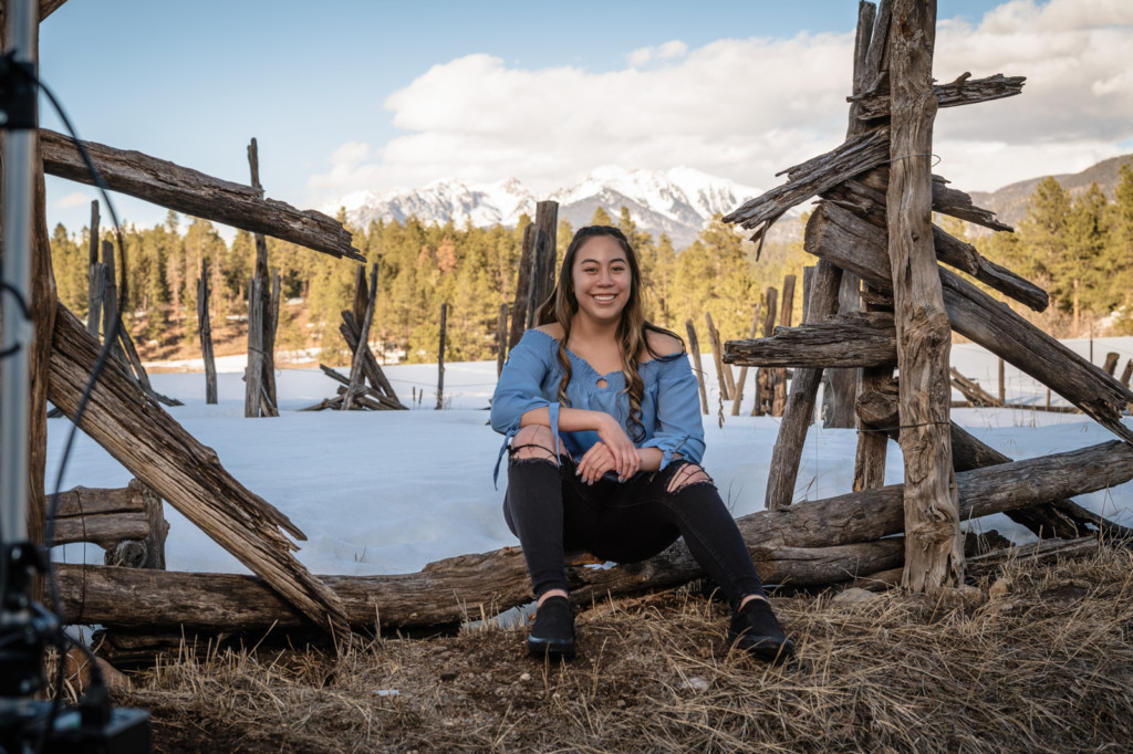class of 2022 senior pictures durango co rustic fence with mountains