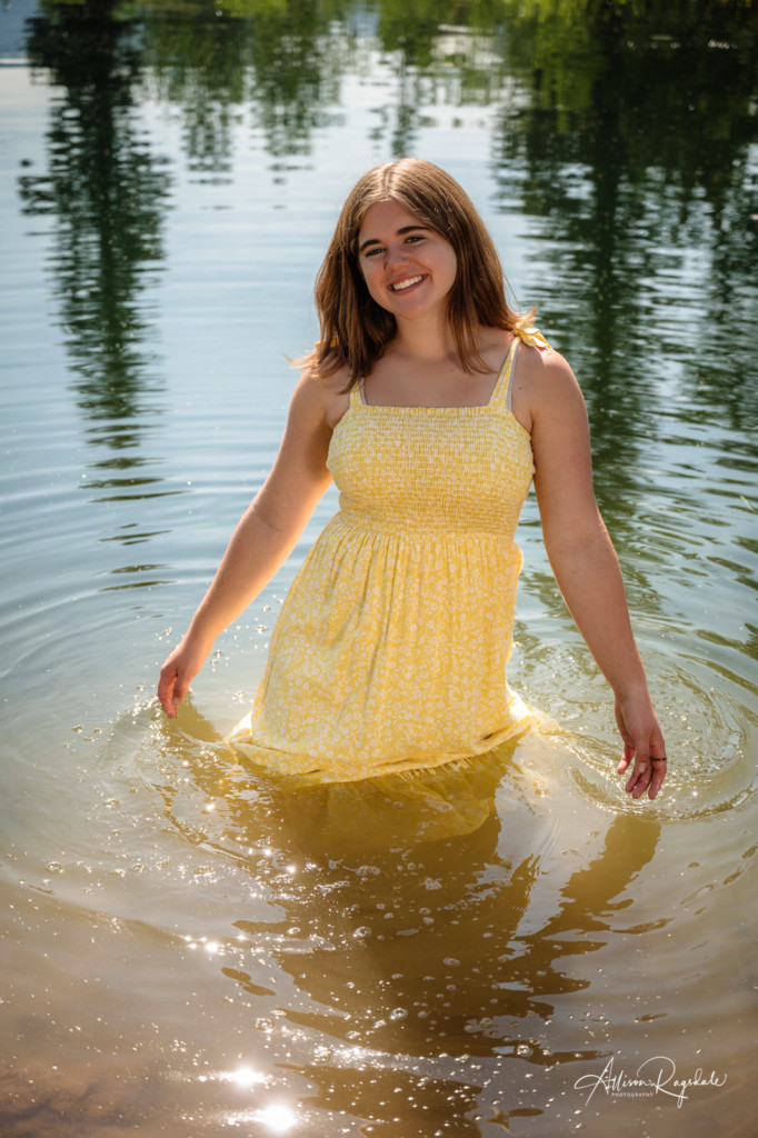 girl in yellow dress in lake colorado senior pic
