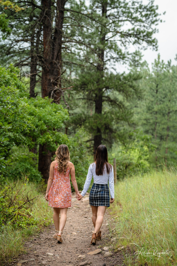sisters walking down colorado trail picture