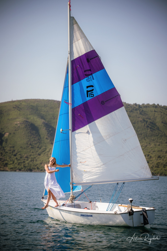 girl in white dress sailboat lake nighthorse photo