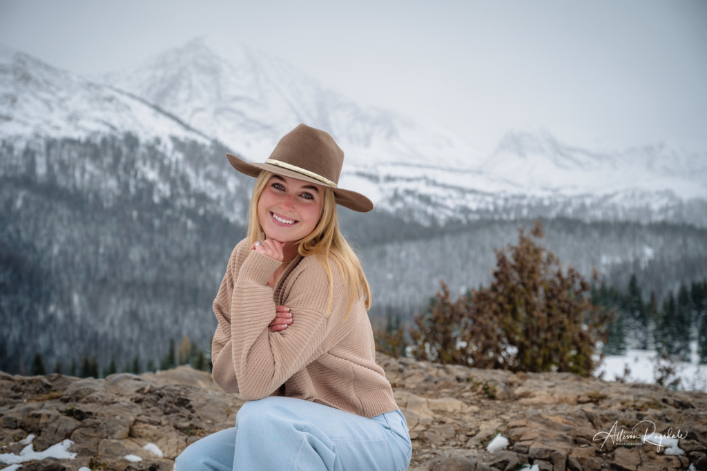 girl senior picture snowy mountain backdrop