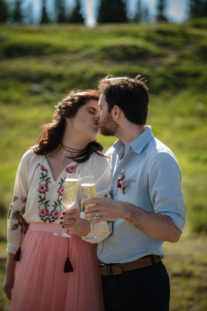 elopement newlywed champagne toast and kiss picture