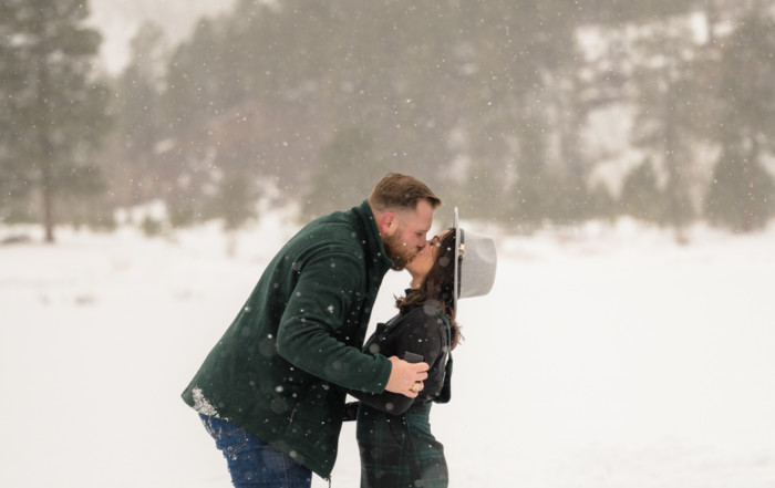 newly engaged couple on ice skates kissing picture