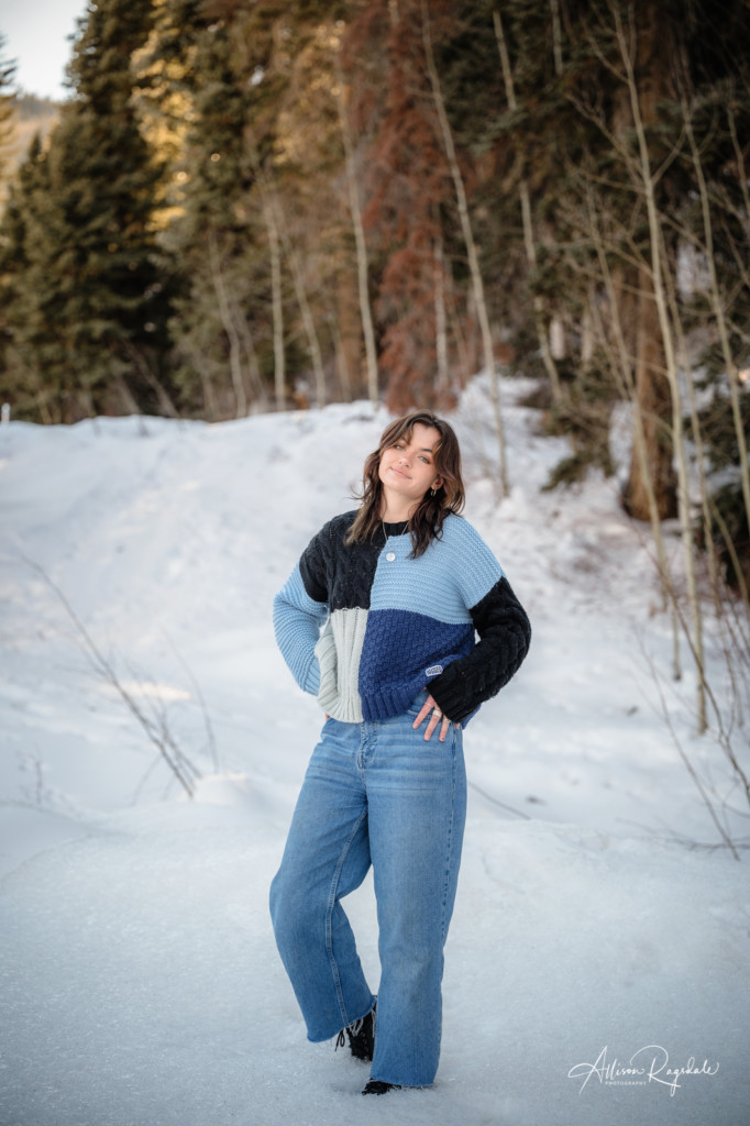 girl standing in snow colorado winter senior photo